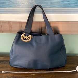 Michael Kors Navy Blue Hobo bag with gold hardware.